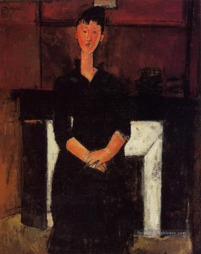  assise - femme assise près d’une cheminée 1915 Amedeo Modigliani